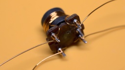 The wires are wound around the core, and then wrapped around the pins.